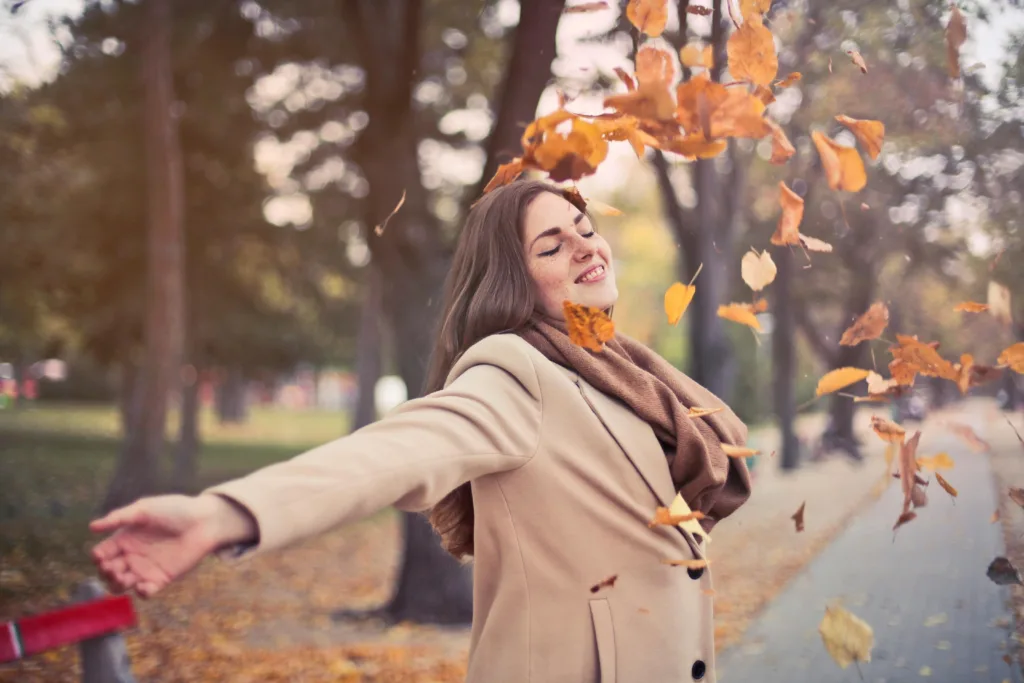 Woman smiling in autumn setting